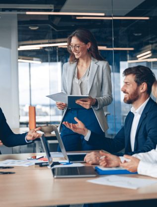 A Group Of Business People Partners During A Set Team Meeting In The Modern Office